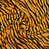 Maille velours et lurex tigre noir fond jaune orangé