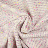 Tweed de laine mélangée confettis rose et bleu fond violet