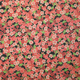 Coton imprimé fleurs de cerisier rose corail fond noir
