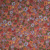 Crêpe viscose imprimé envolée florale fond cassis glacé