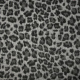 Jacquard de polyester peigné léopard fond gris