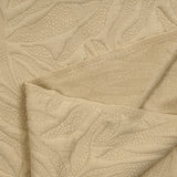 Jersey matelassé fissures fond beige