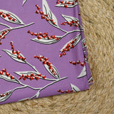 Maille de viscose satinée imprimée brin de muguet fond mauve