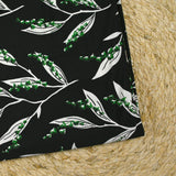 Maille de viscose satinée imprimée brin de muguet fond noir