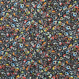 Mousseline crinkle imprimée irisée miette de fleur fond noir