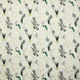 Cotton poplin printed with winter branches, golden balls and stars on an ecru background