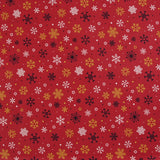 Popeline de coton imprimée neige fond rouge