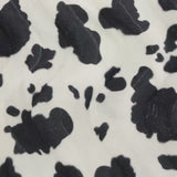 Fausse fourrure poils mi-longs vache noir