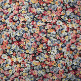 Viscose printed with bluish gray heather and wine lees, black background