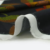Viscose imprimée fleurs en traits fond noir