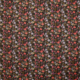 Voile de coton imprimé digital prairie de petites fleurs orange et jaune beurre sur fond noir