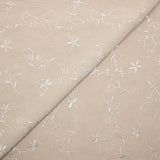 Voile de polyester brodé fleurs et feuillages beige