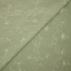 Voile de polyester brodé fleurs et feuillages vert sauge