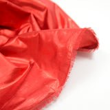 Poliéster de lamé rojo